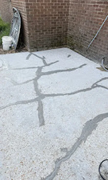 Cracked concrete patio before epoxy coating and crack repair - Signature Surface Solutions Walker LA